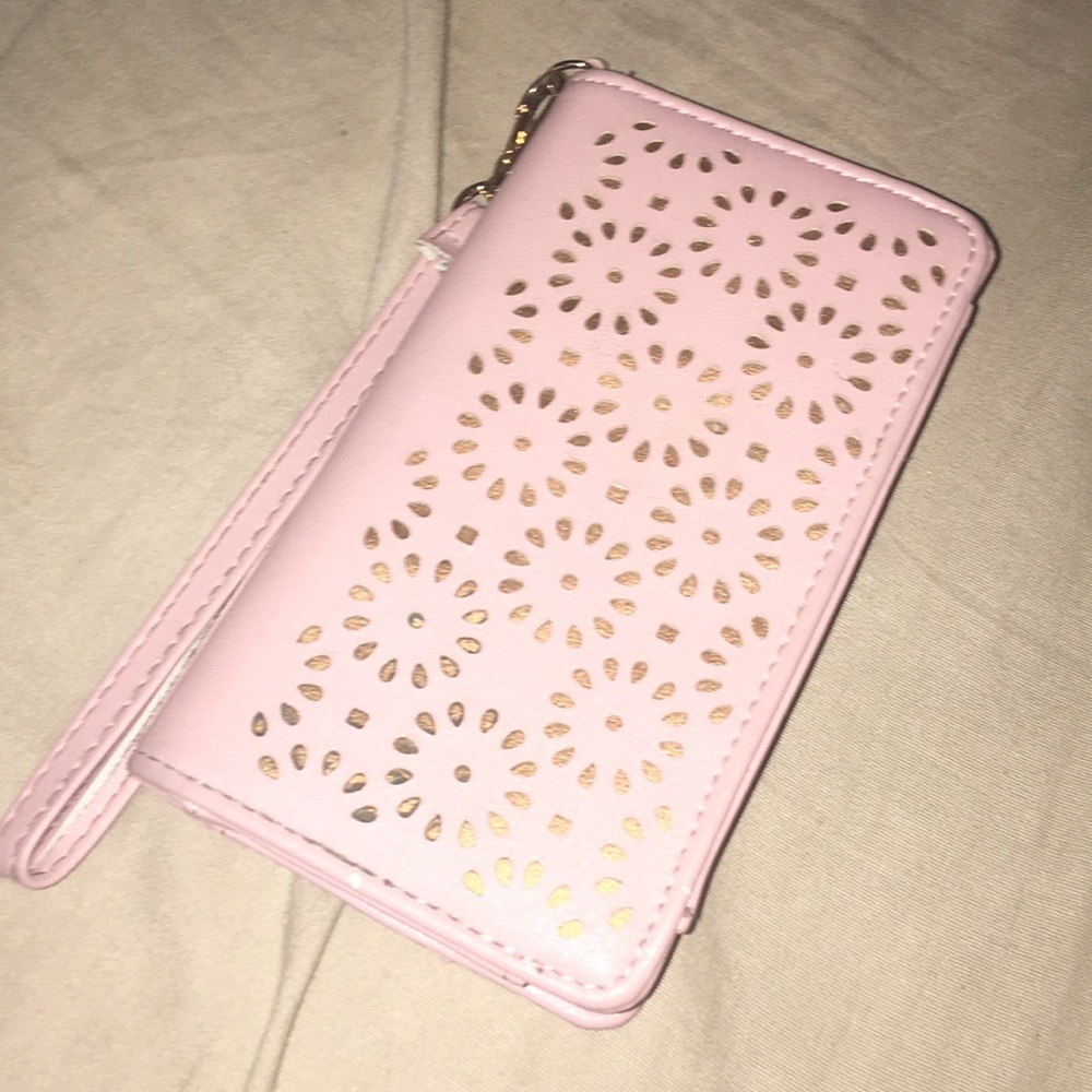 A pink and gold wallet